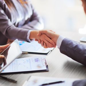 Business people shaking hands finishing up a meeting